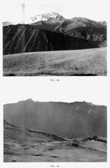 Fig. 44—The snow-capped Cordillera Vilcapampa north of
Yucay and the upper canyon of the Urubamba from the wheat fields near
Chinchero. In the foreground is one of the well-graded mature slopes of
Fig. 123. The crests of the mountains lie along the axis of a granite
intrusion. The extent of the snowfields is extraordinary in view of the
low latitude, 13° S.